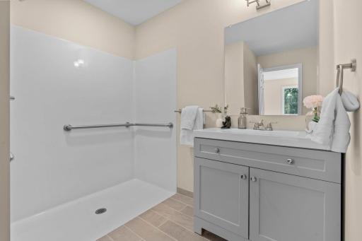 Private 3/4 bathroom with a roll-in shower located in the fourth bedroom.