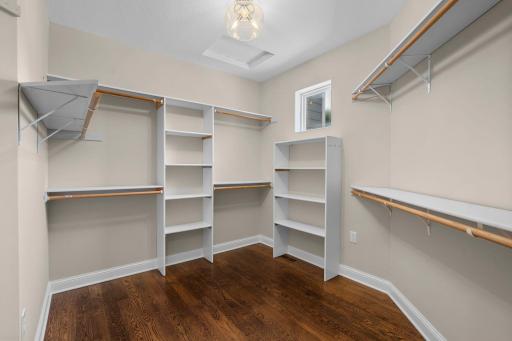 Spacious walk in closet with built-in's located in the primary suite.