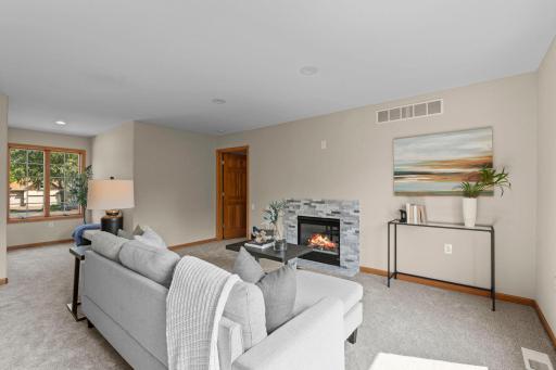Electric fireplace located in the mother-in-law suite, with stunning stone surround.