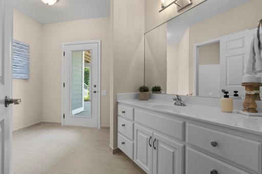 Full walkthrough bathroom on the lower level also serving the pool with exterior access.