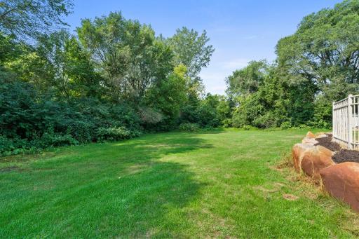 Mature greenery surrounding the yard offering privacy.