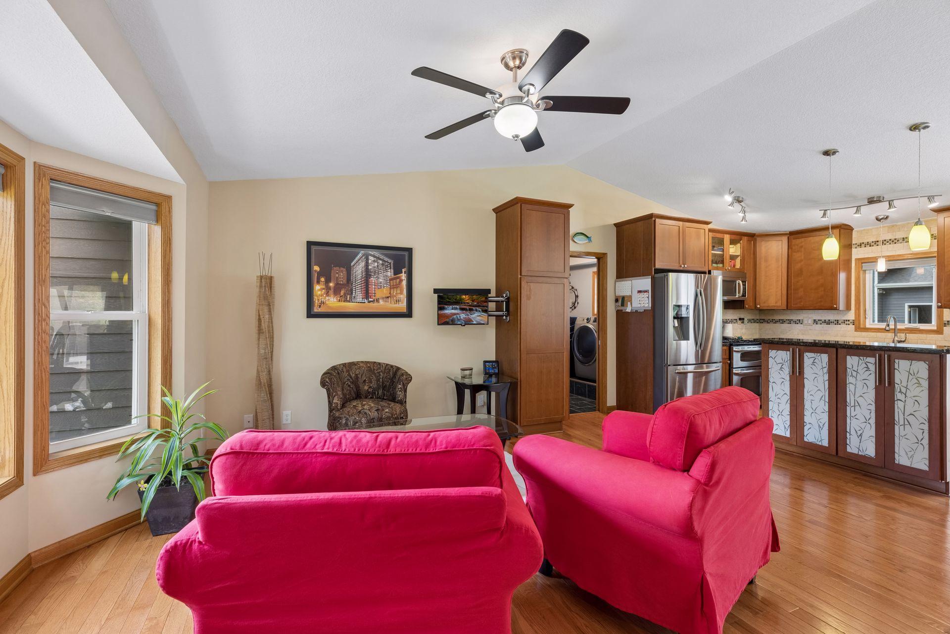 The vaulted ceiling enhances the sense of openness while creating a natural flow between the living room and kitchen.