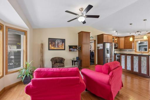 The vaulted ceiling enhances the sense of openness while creating a natural flow between the living room and kitchen.