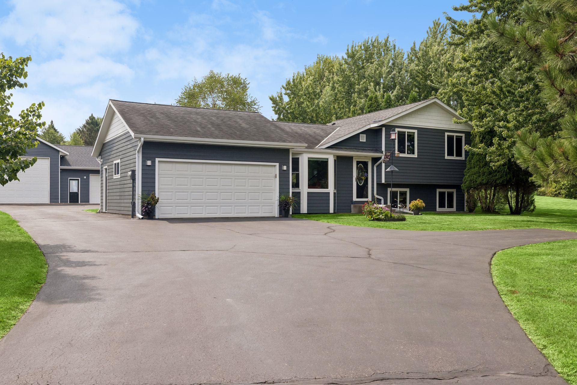 Welcome home to 8255 Stillwater Blvd! A fantastic home and property located in a beautiful setting, with inviting spaces and plenty of room to enjoy both inside and out.