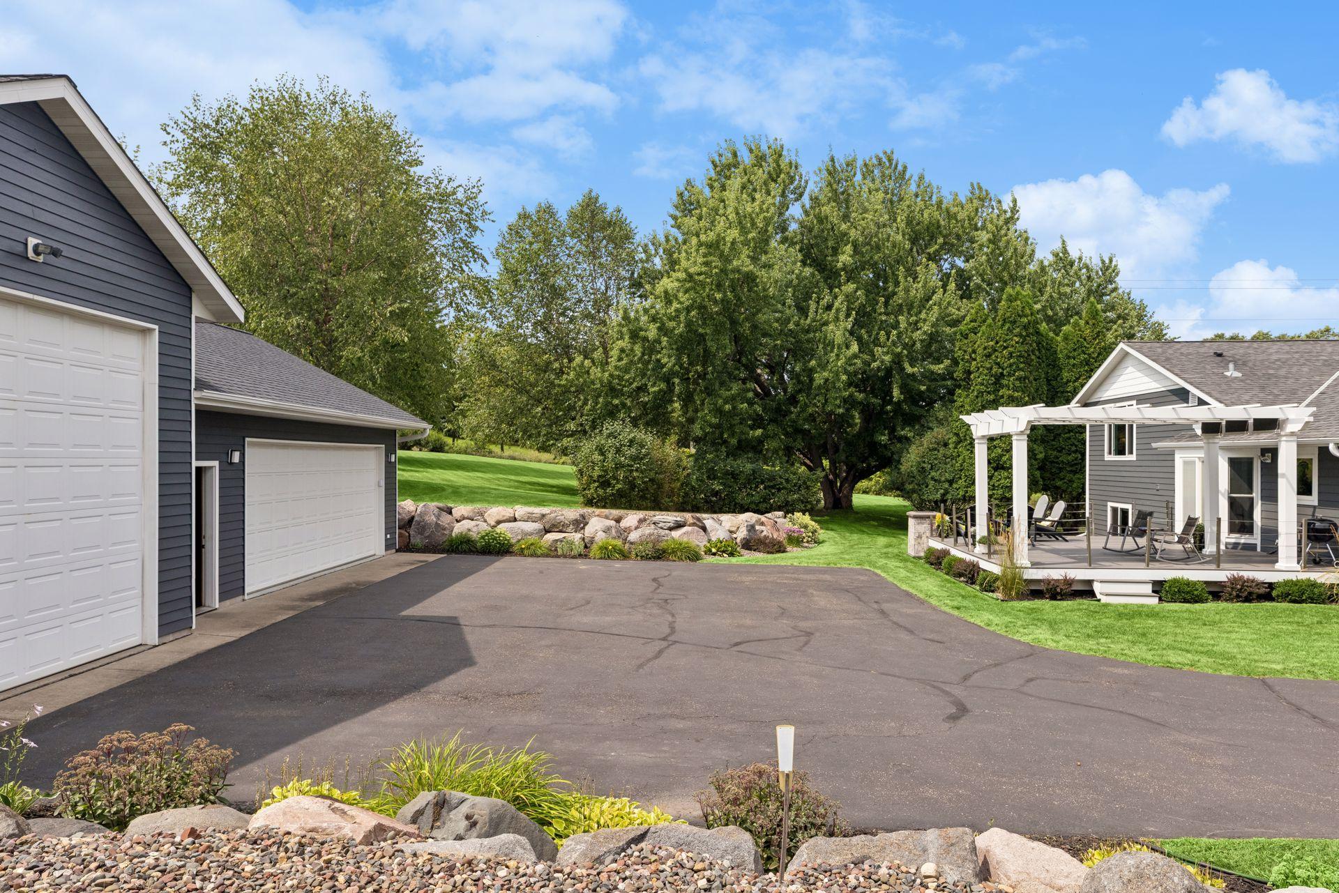 Plenty of parking and storage options! A short walk out the back door to the massive 2nd garage