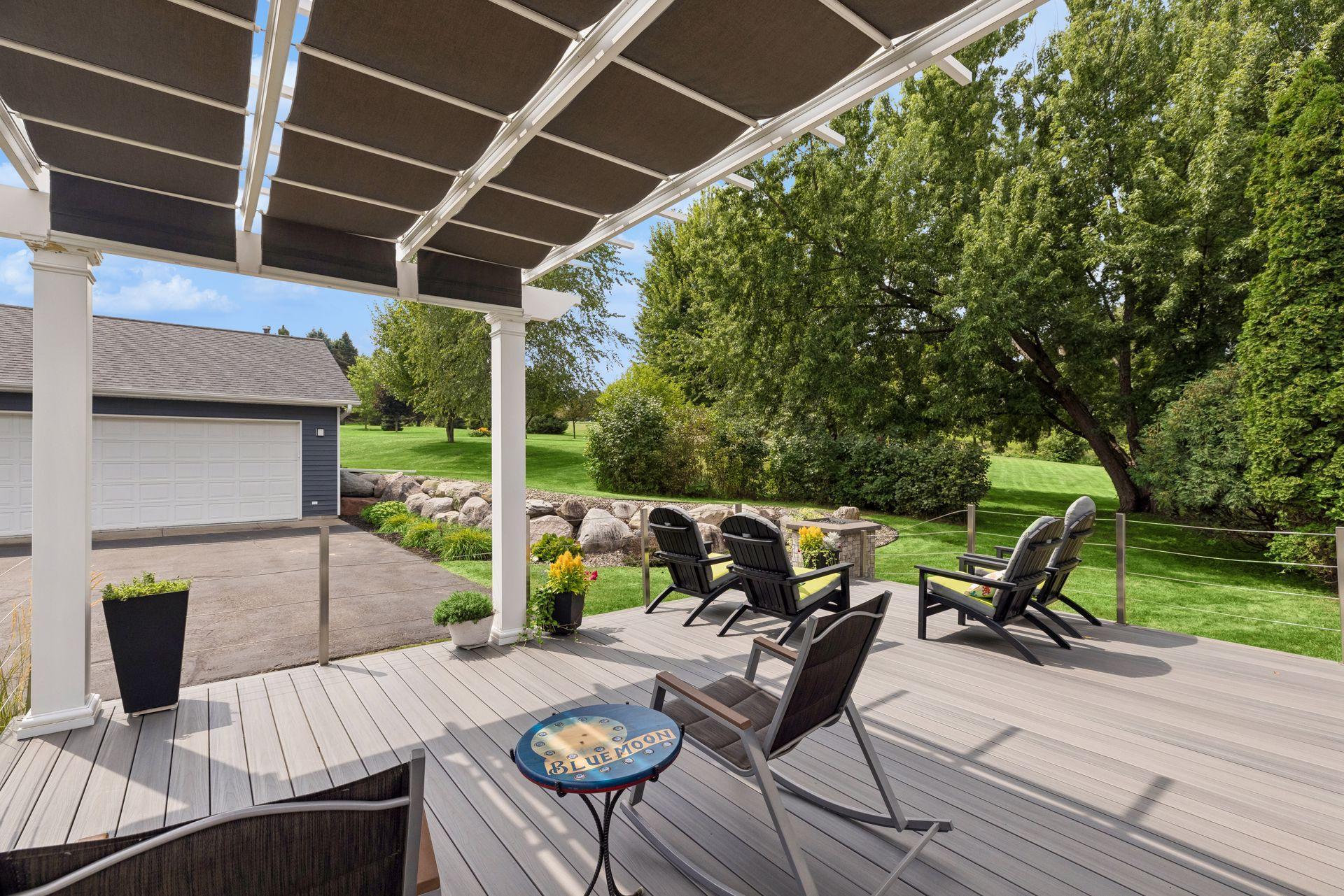 The maintenance free deck extends outdoor living with a covered pergola and propane fire pit, creating a welcoming space to enjoy year round.