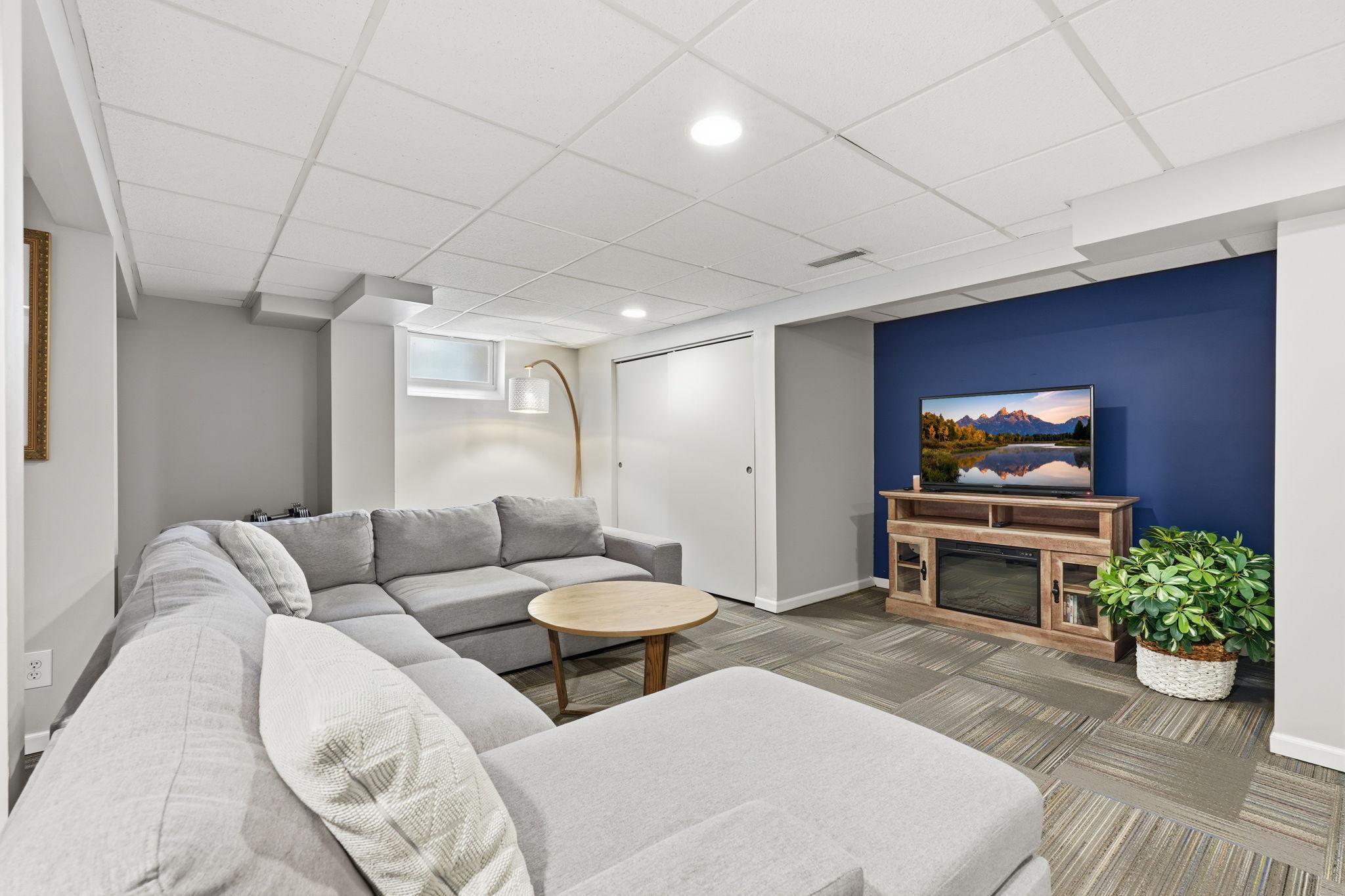 The lower level can be used in many ways. Plenty of room for everyone to enjoy movie night.