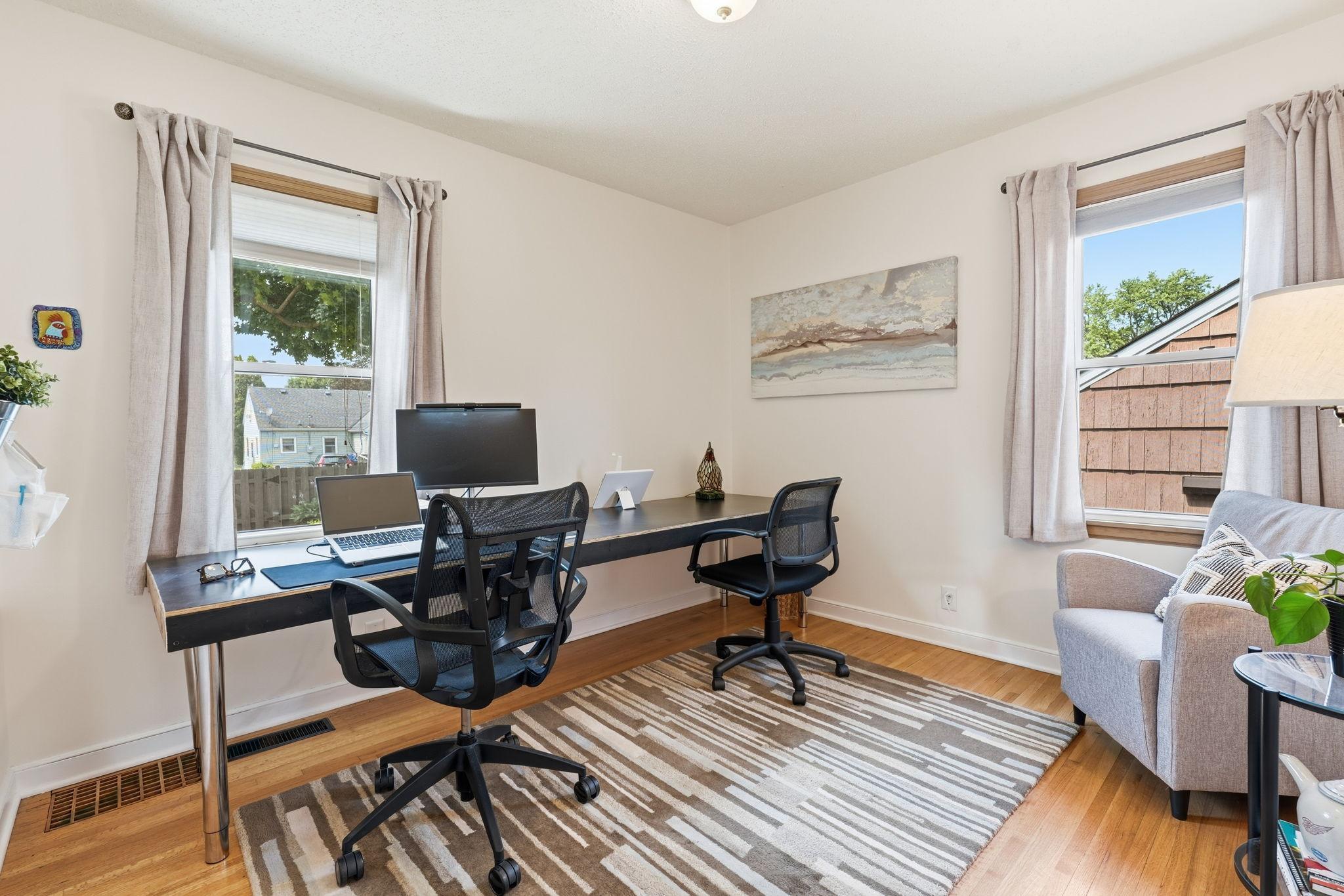 The second main floor bedroom overlooking the backyard is also a great space for an office or den.