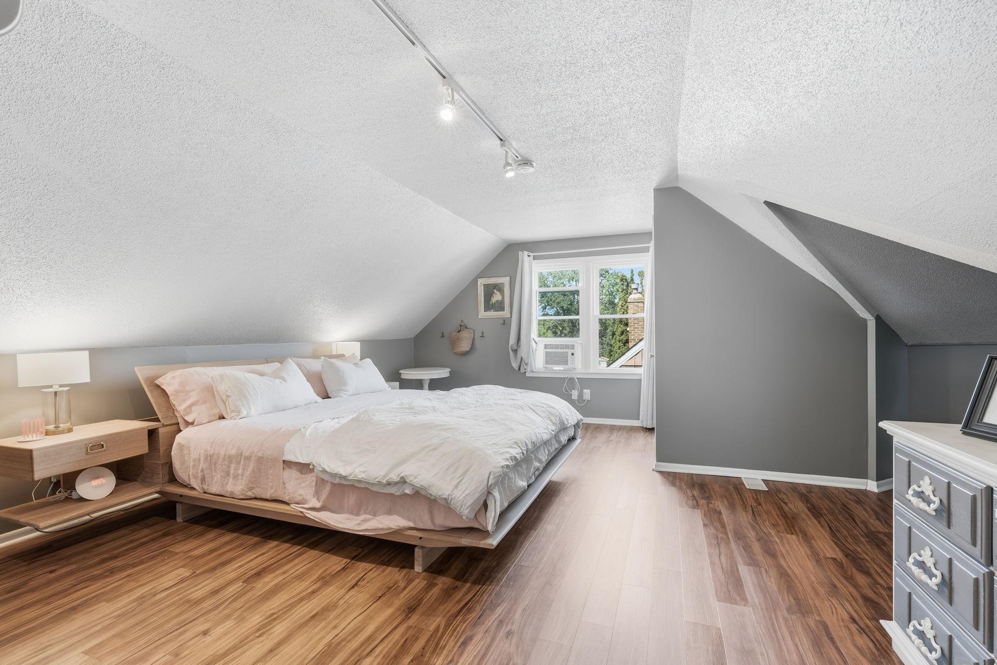 Plenty of room up here for a king size bed. The 1/2 bath is tucked behind the wall.