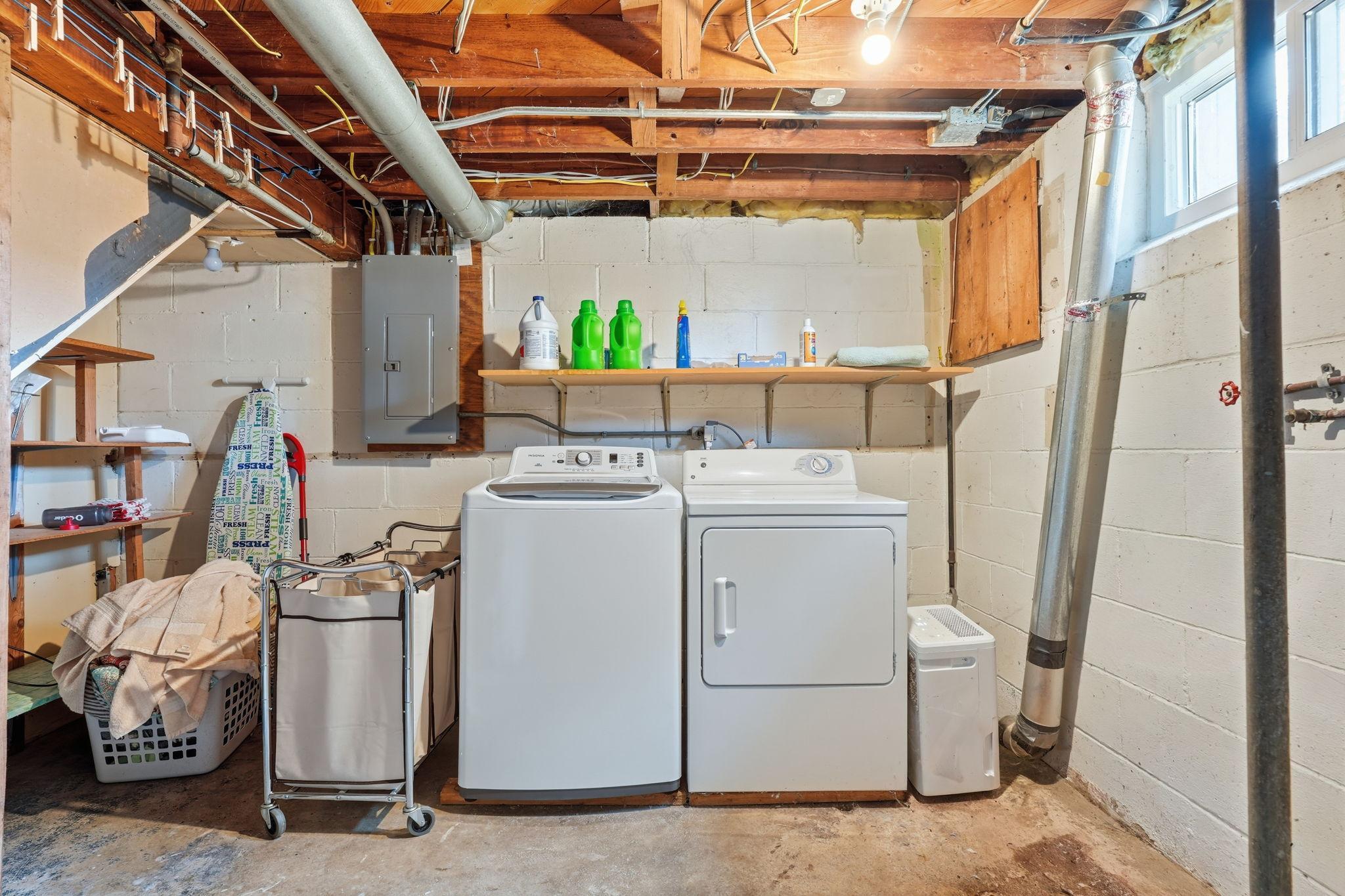 Nice size lower level laundry room.
