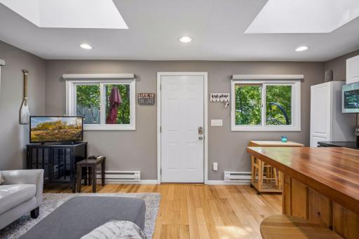 Hardwood floors and skylights greet you upon entering the home.