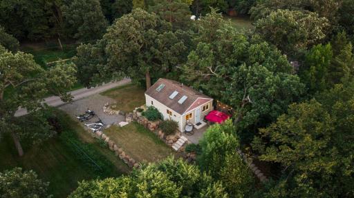 The lake home has grassy area off the side of the home.