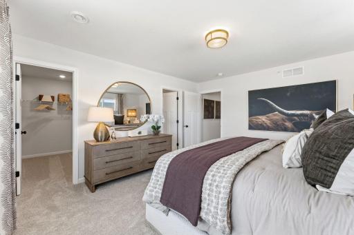 Make yourself at home in this inviting owner's suite, complete with walk-in closet. *Photo of a previously built home of the same floor plan. Finishes/options may vary.