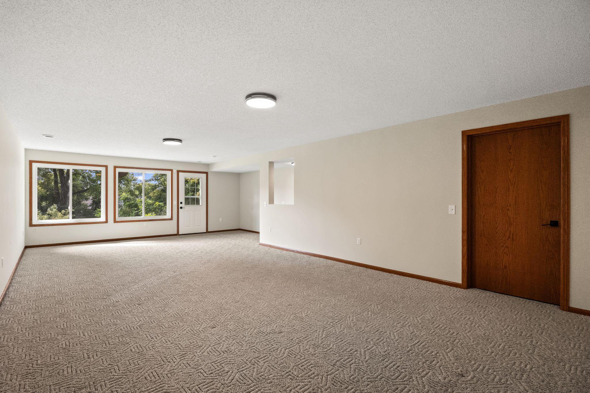 Lower level walkout family room expands your gathering space.
