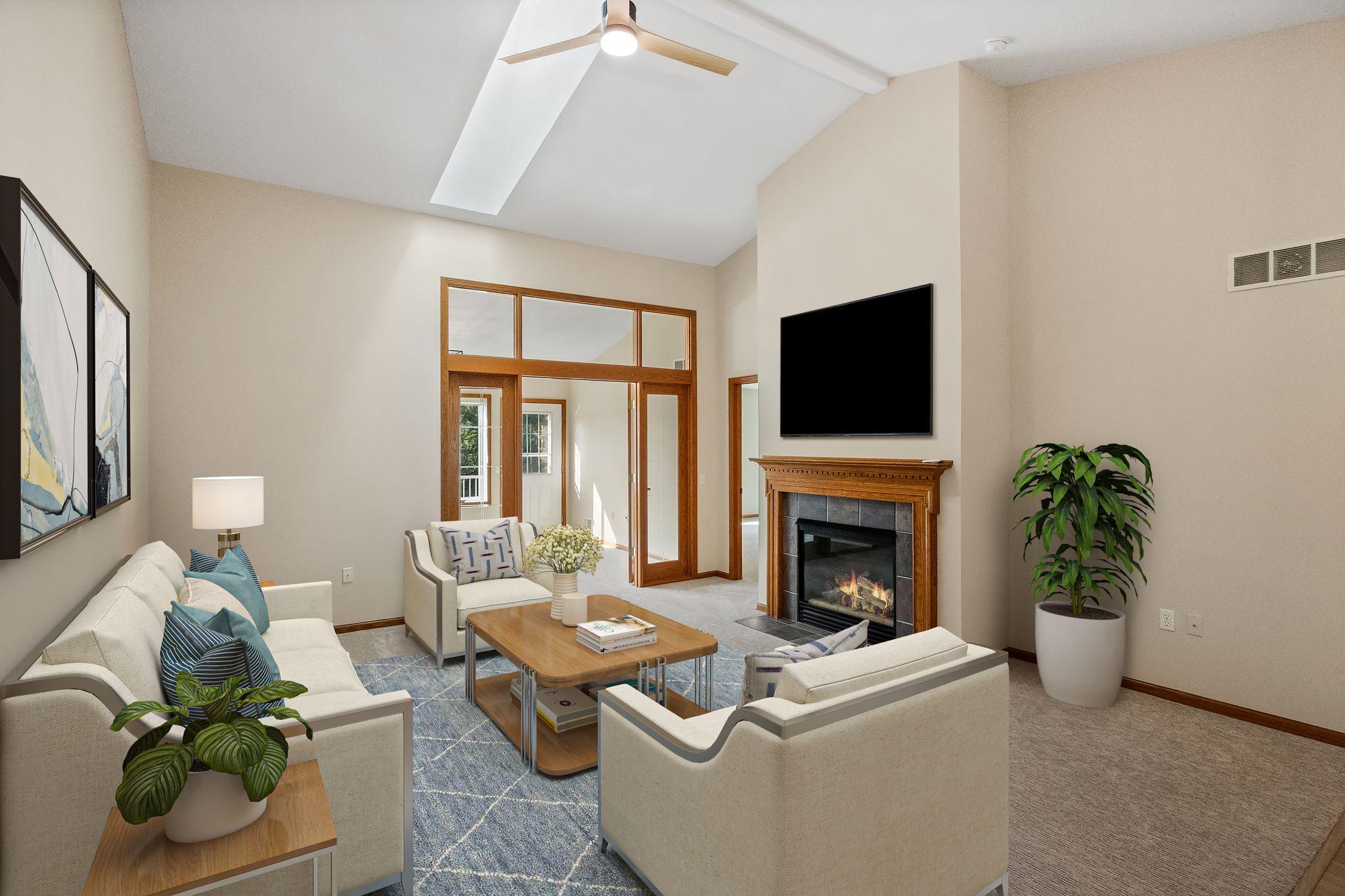 Living room is anchored by a cozy fireplace.
