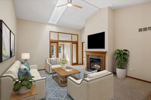 Living room is anchored by a cozy fireplace.