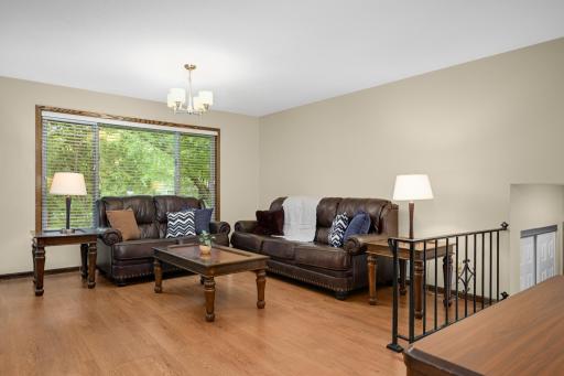 Main level livingroom with beautiful flooring!