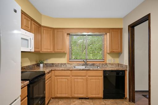 The kitchen is bright and has plenty of storage space!