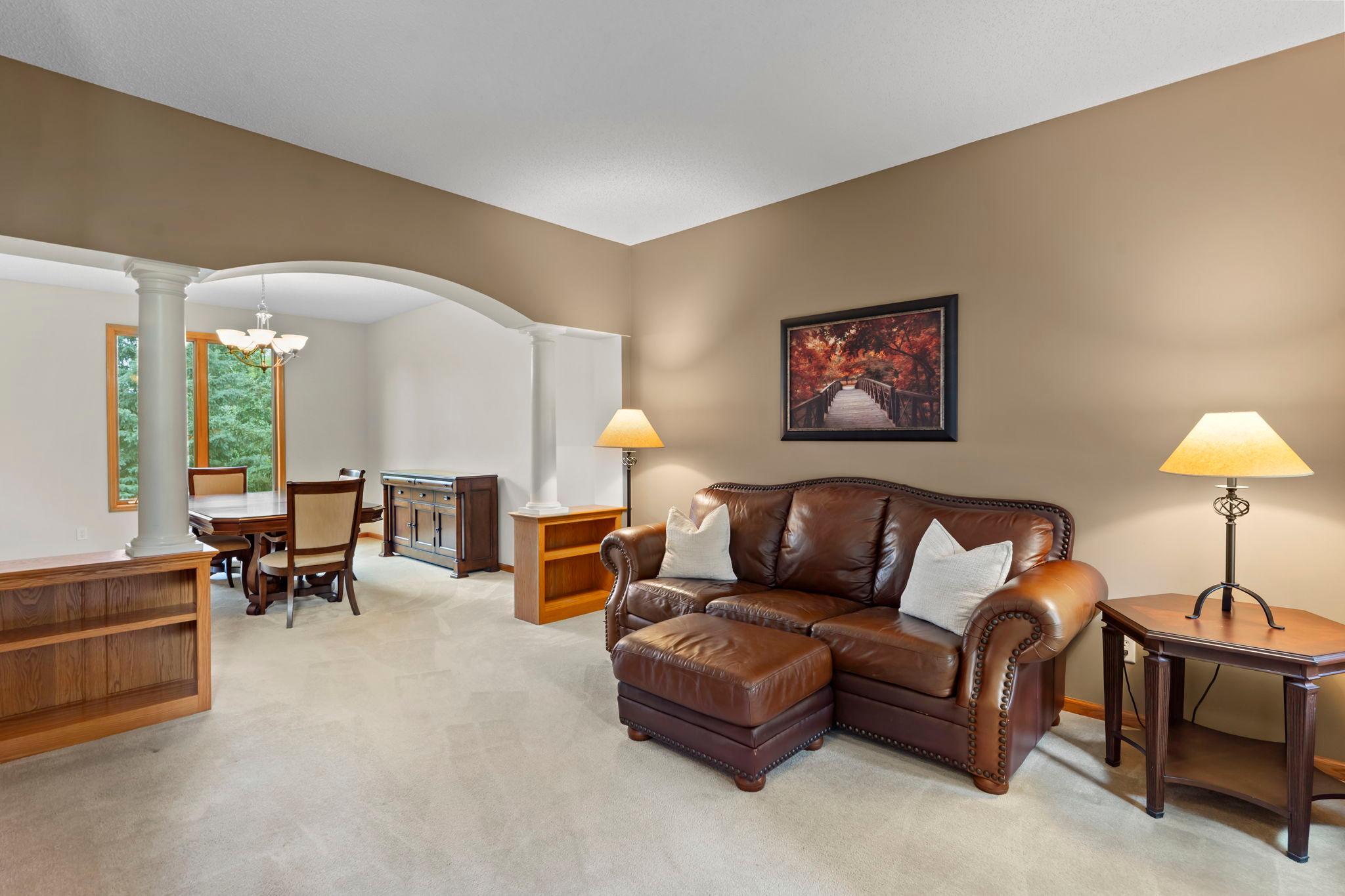 To the right sits the living room with access to the formal dining room