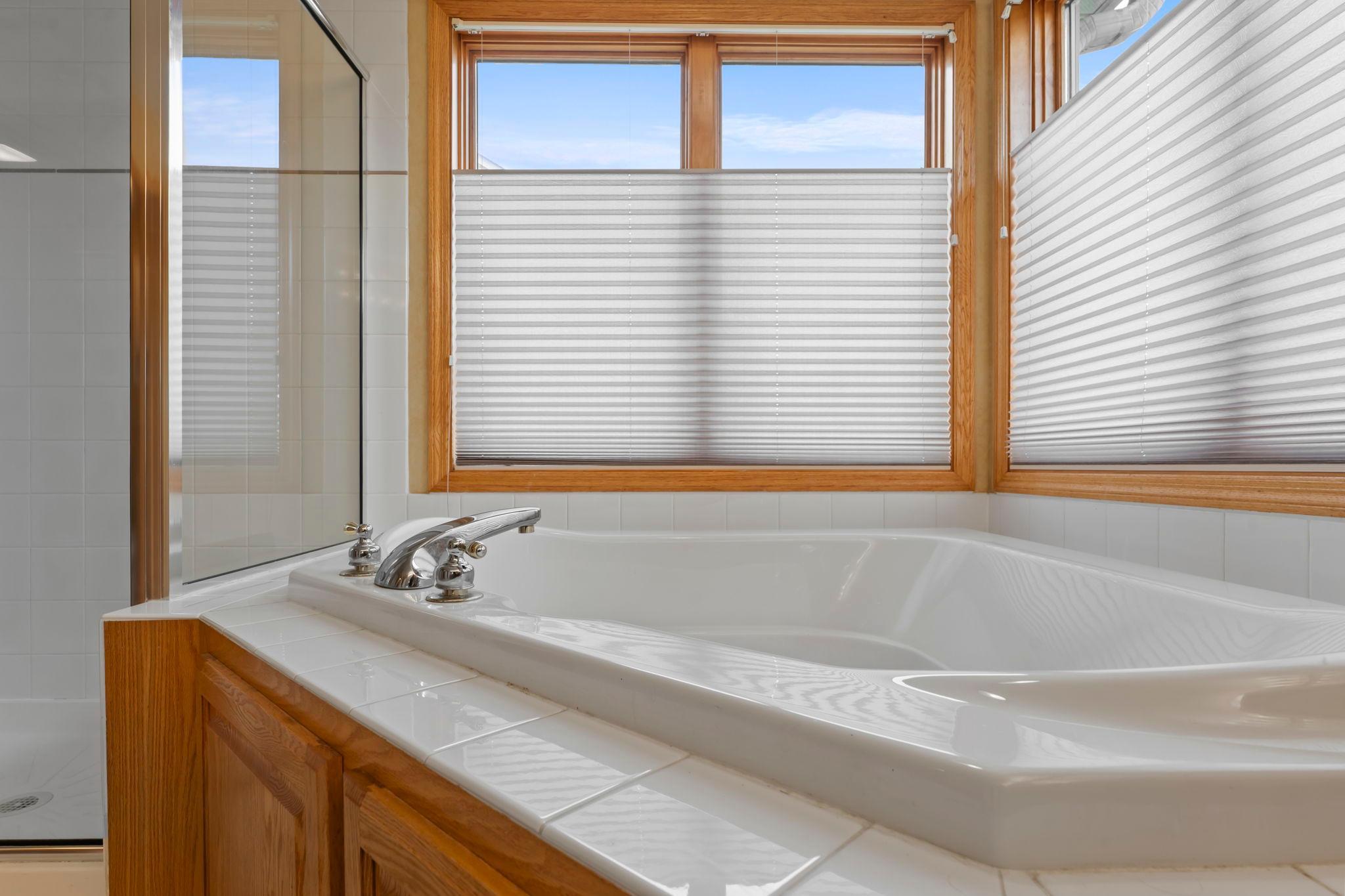 Jetted tub beneath the windows