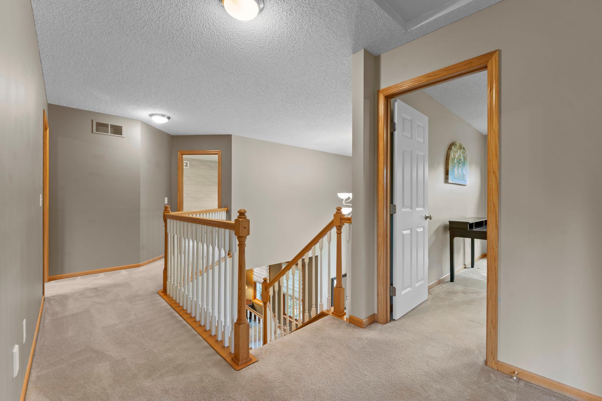 Upstairs leads to 4 bedrooms including a massive primary suite