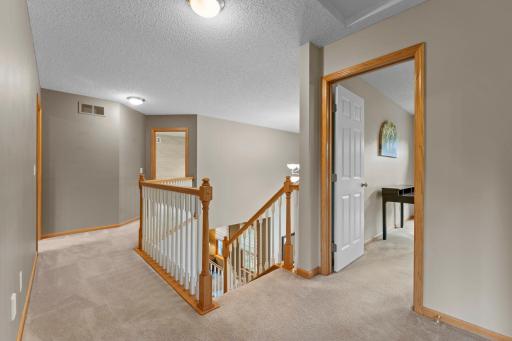 Upstairs leads to 4 bedrooms including a massive primary suite