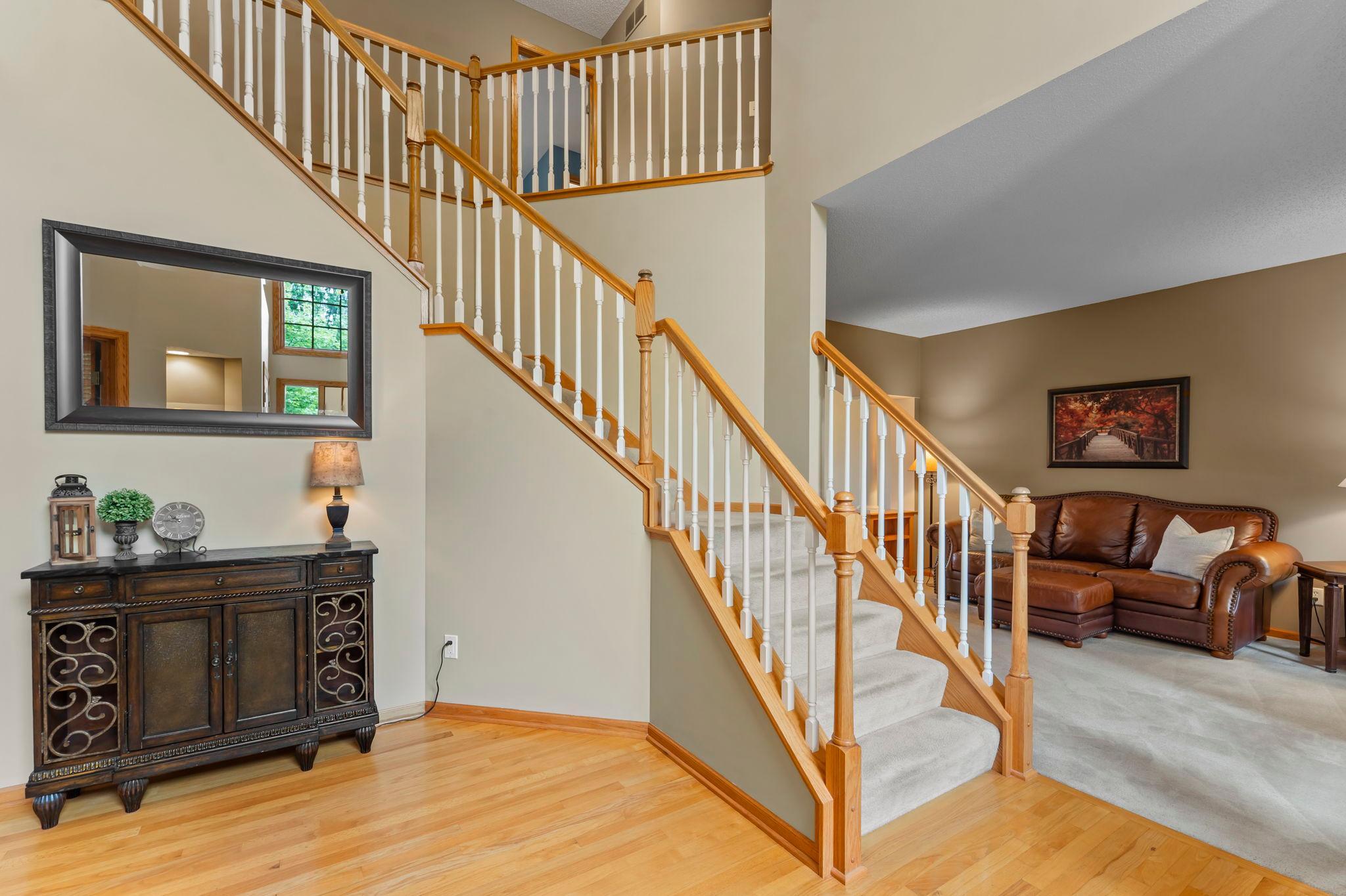 Exquisite entry welcomes you with a grand staircase and timeless elegance