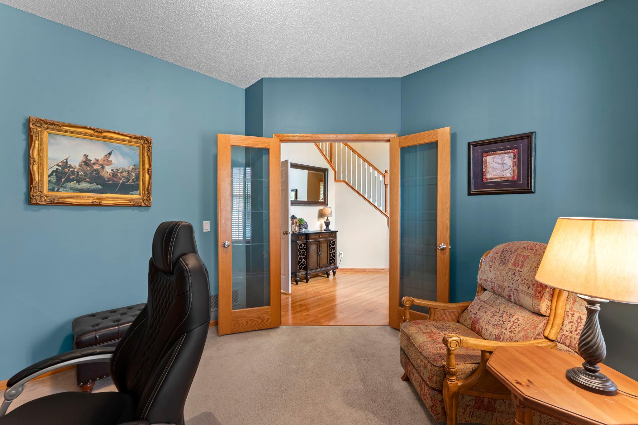 A main level office through french doors offers a great work from home space