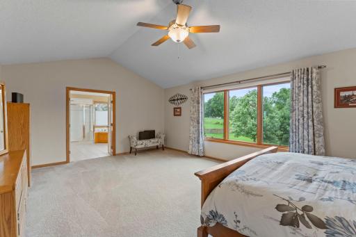 Primary bedroom with ensuite bath and walk-in closet