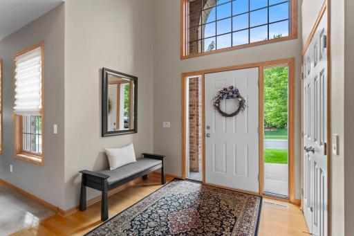 Step inside to a bright, vaulted foyer filled with natural light