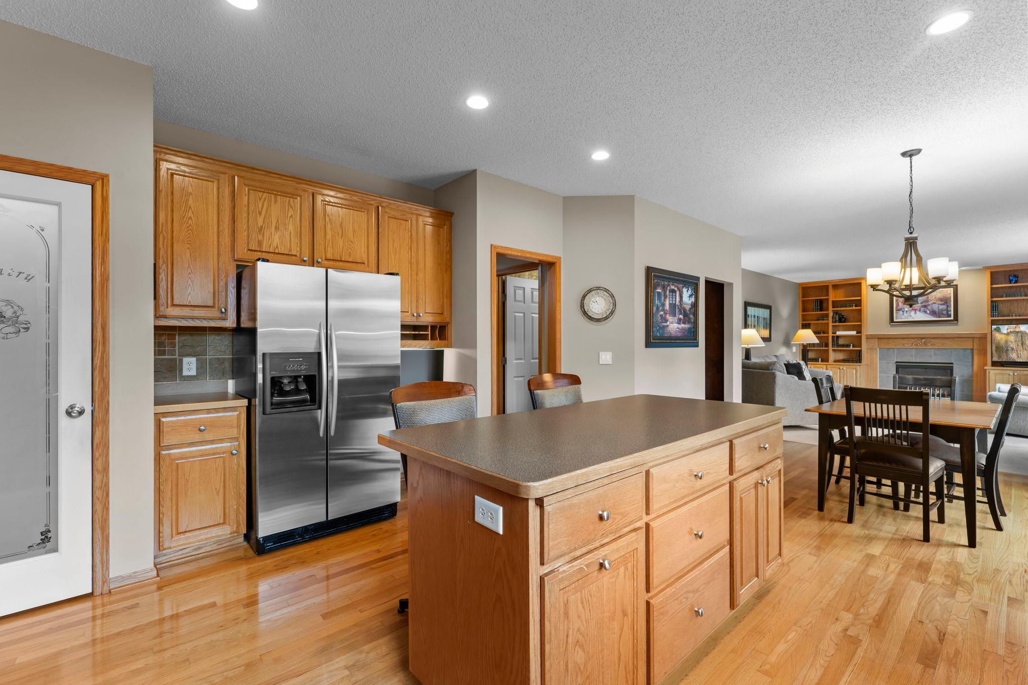 Enjoy stainless steel appliances, generous storage, hardwood floors, and an open layout