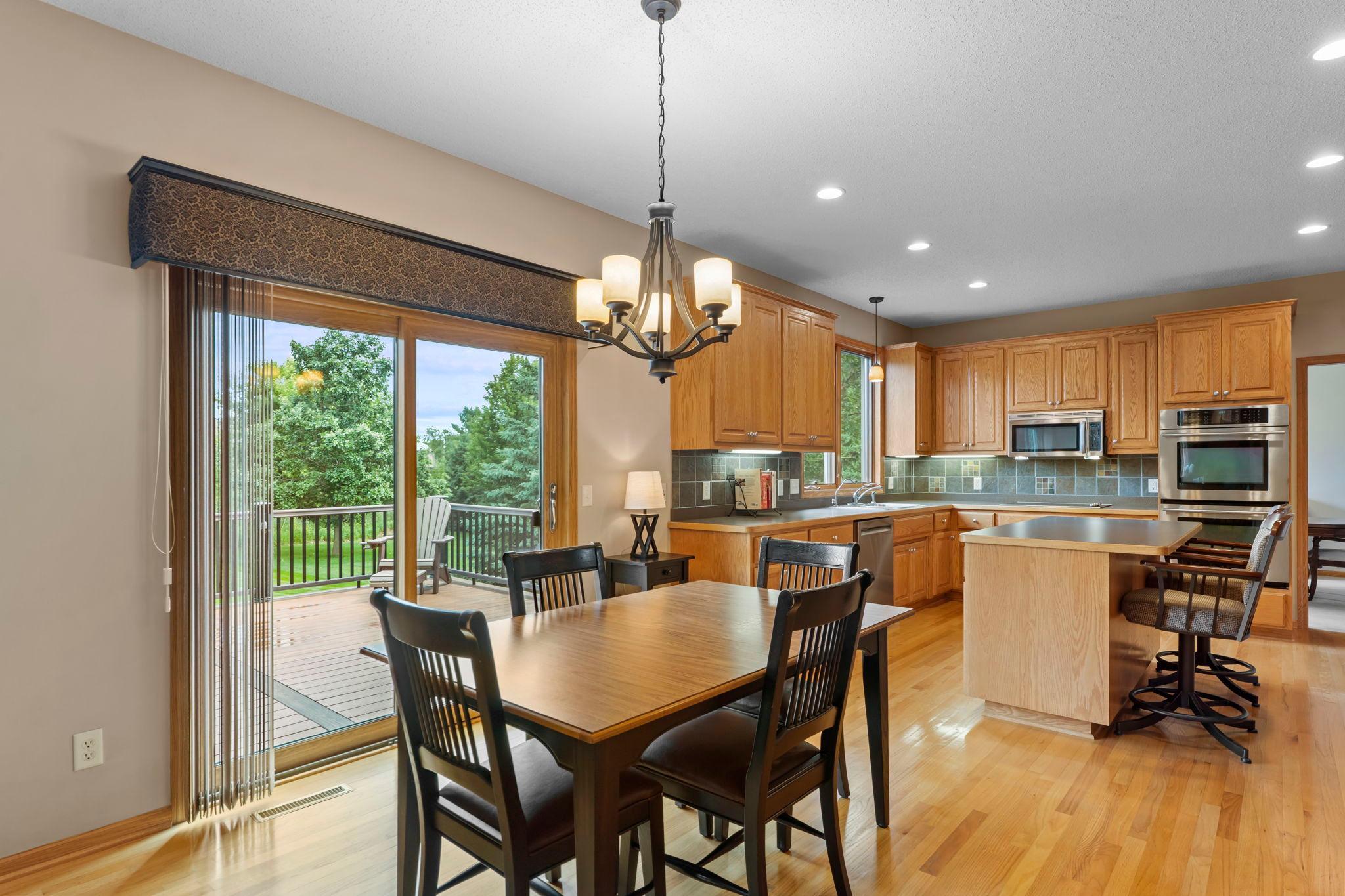 Open kitchen and informal dining leads out to the deck