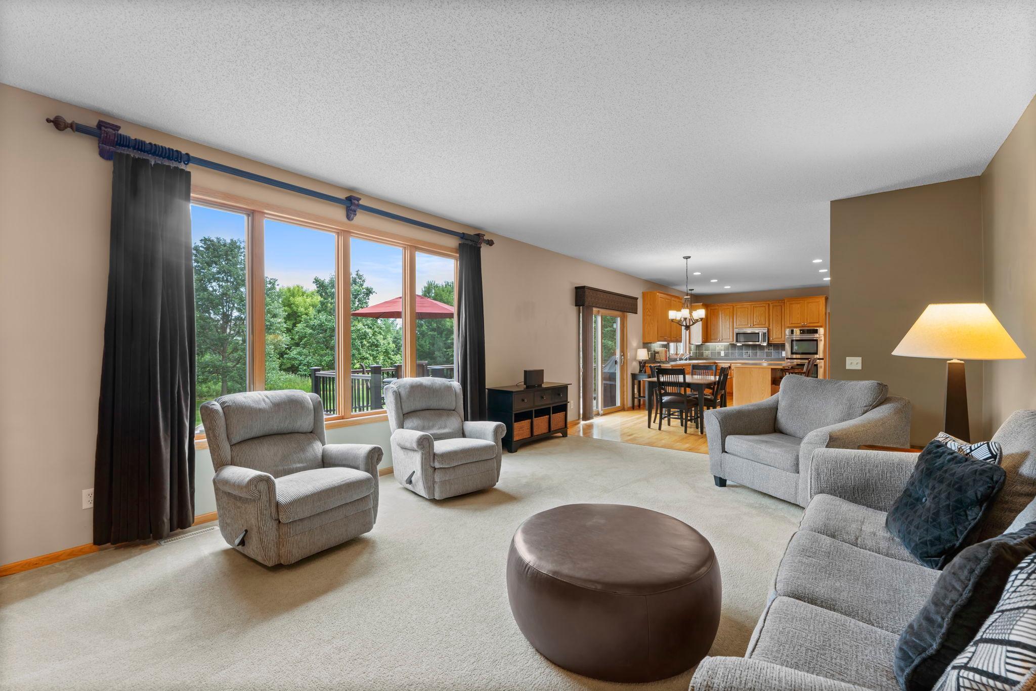 The cozy family room is accented by a large window offering great views and natural light