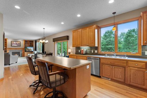 Spacious kitchen with abundant cabinetry, a large center island, and seating for casual meals