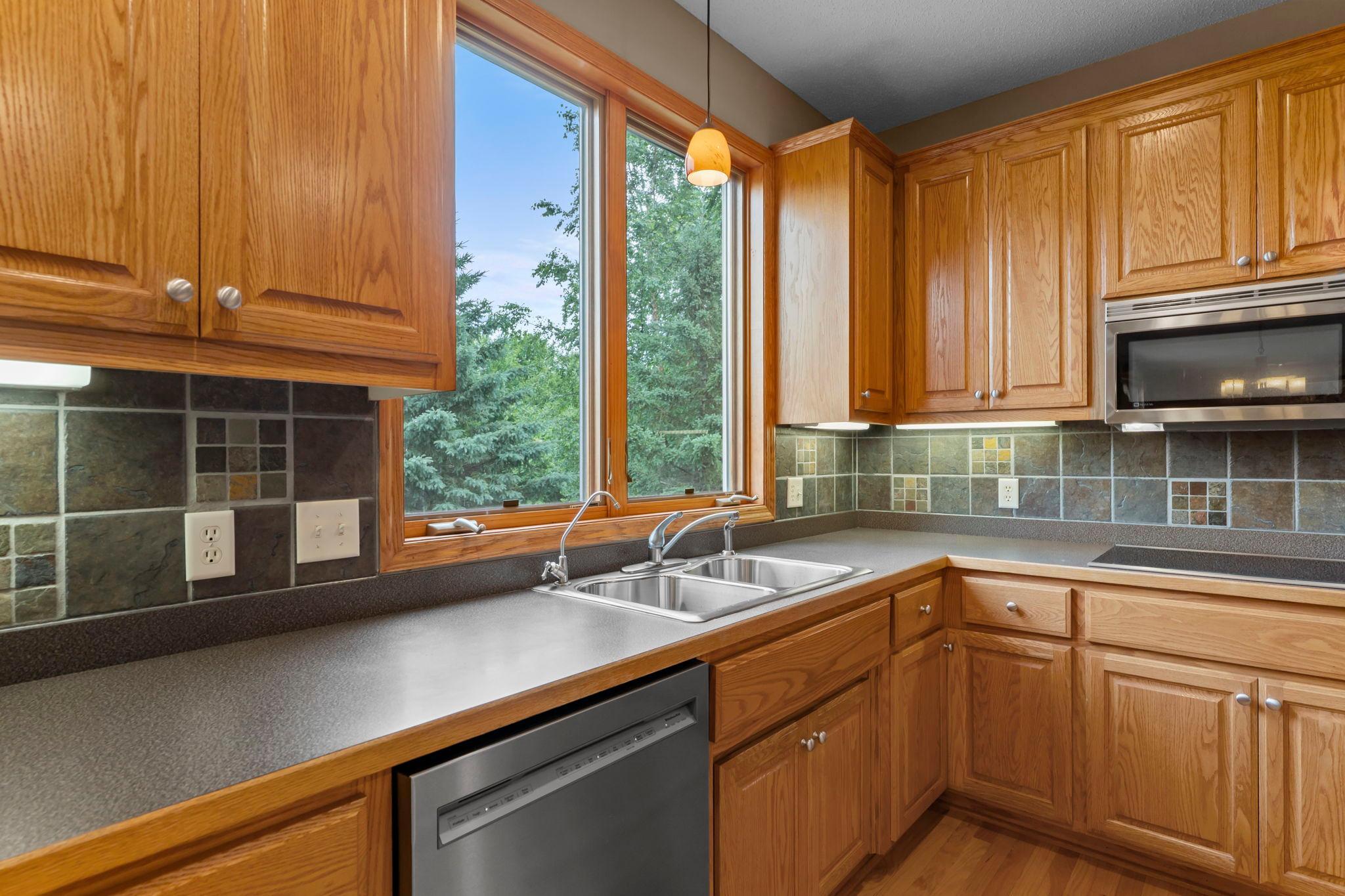 Enjoy views of the backyard as you work at the sink