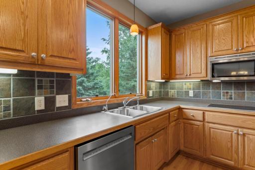 Enjoy views of the backyard as you work at the sink