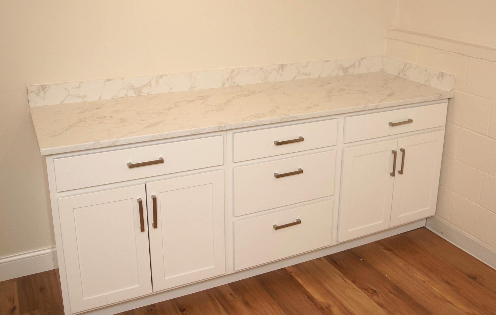 Just painted Laundry Room with new flooring, comes with Washer and Dryer. There is also a new storage cabinet with a nice top for folding clothes.