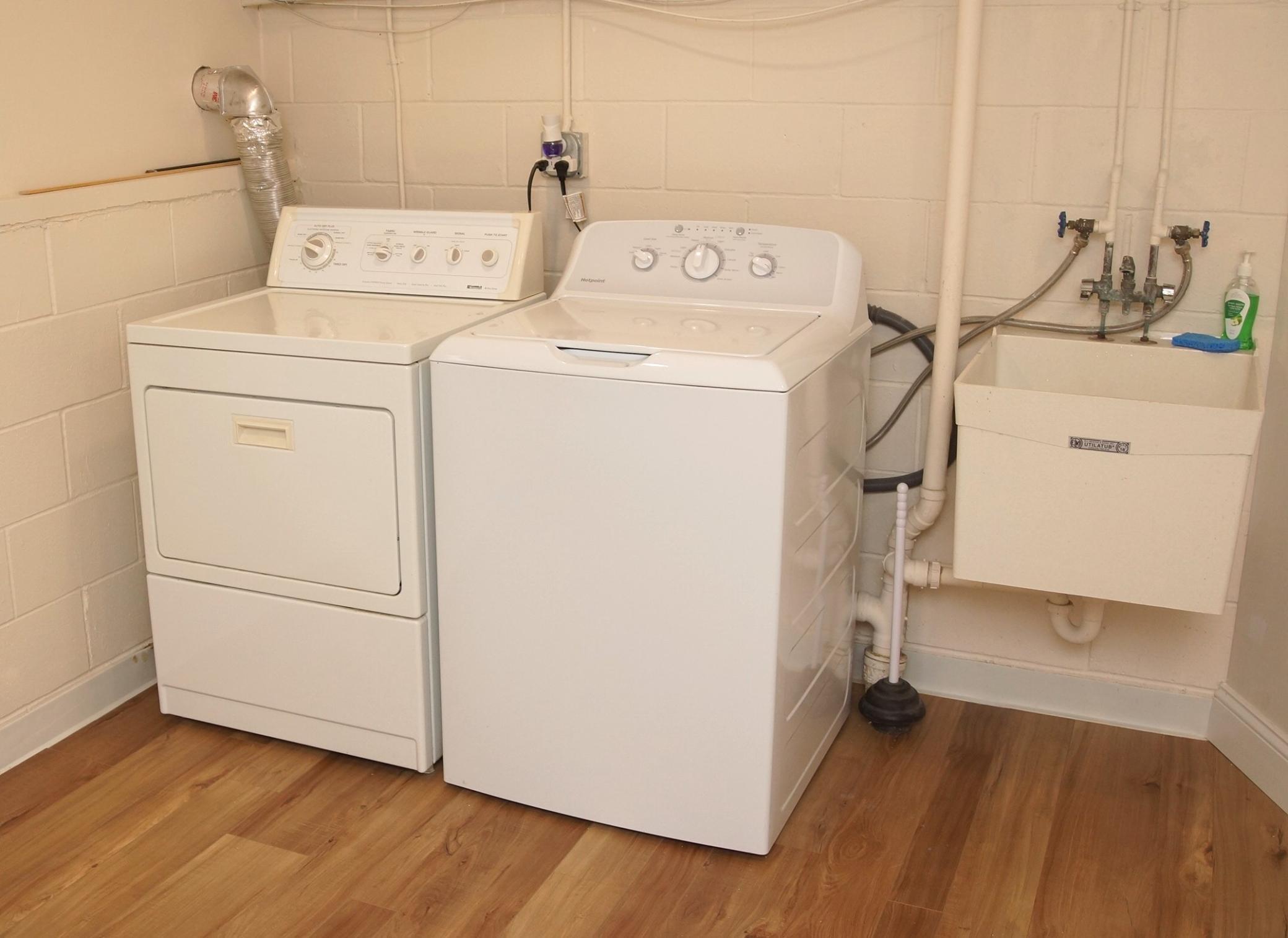 Just painted Laundry Room with new flooring, comes with Washer and Dryer. There is also a new storage cabinet with a nice top for folding clothes.