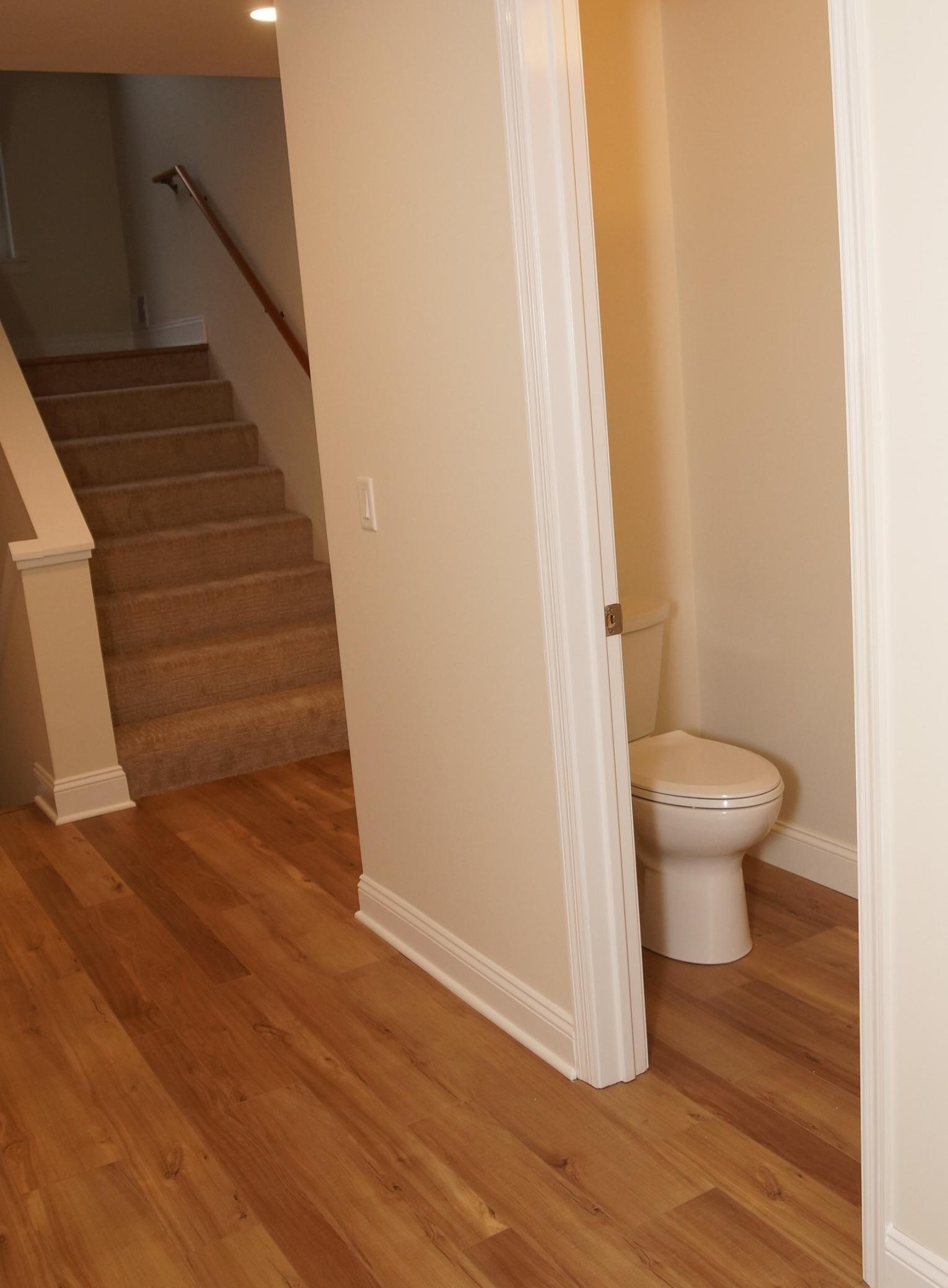 Freshly painted main floor with new flooring, powder room, and an open-concept layout that seamlessly connects the bright living and dining areas. Modern, move-in ready, and perfect for entertaining.