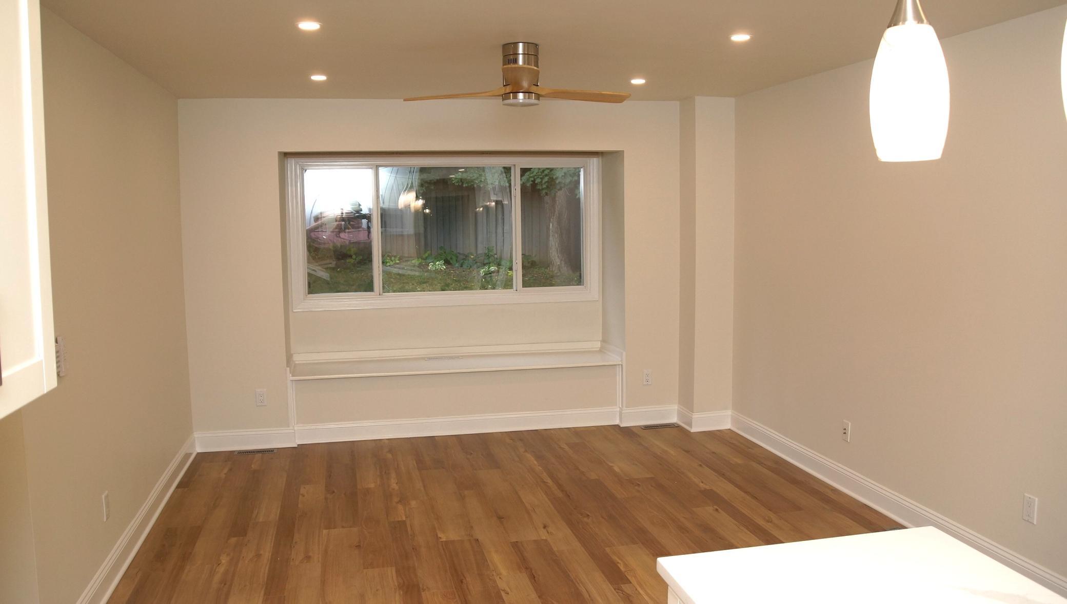 Spacious flex space located directly off the kitchen, perfect for a family room, informal dining area, or home office.