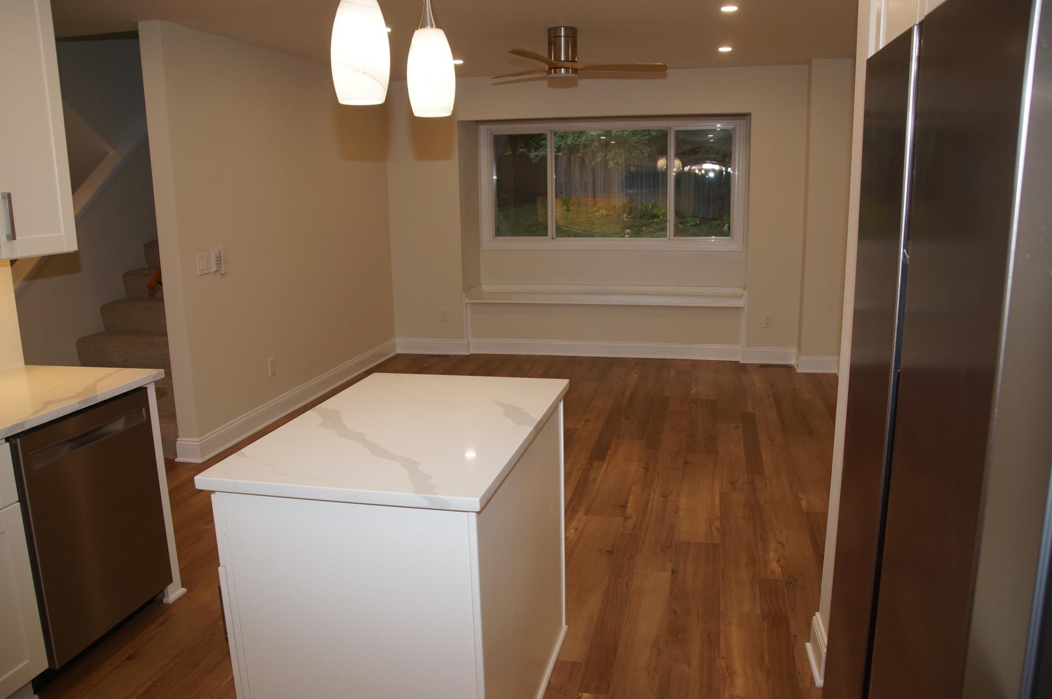 Spacious flex space located directly off the kitchen, perfect for a family room, informal dining area, or home office.