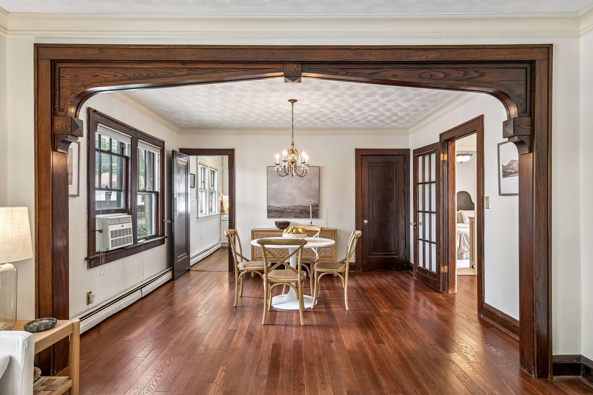 Great Craftsman details- woodwork, french doors and that arch!