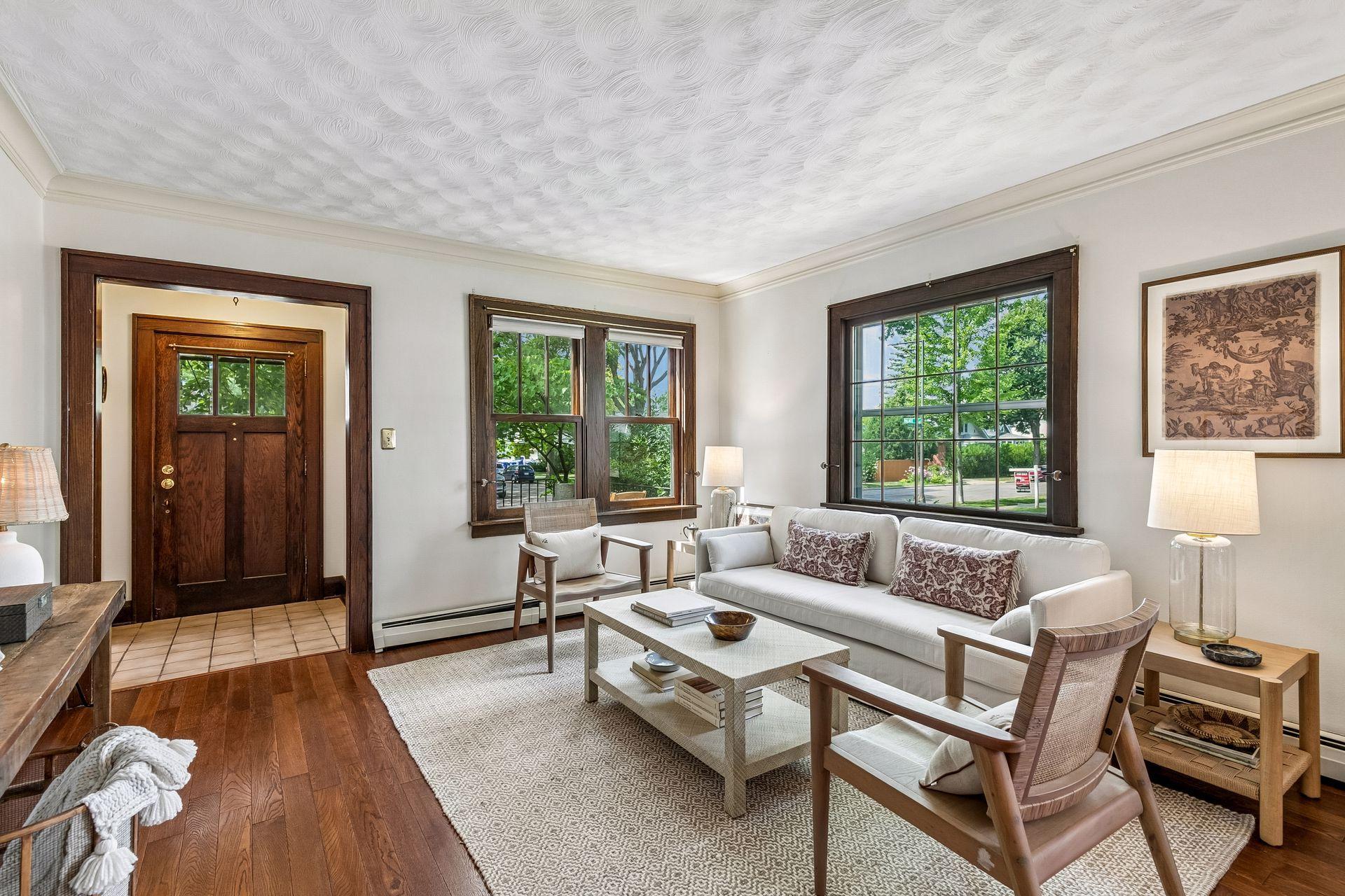 Large living room windows bring the sunshine in