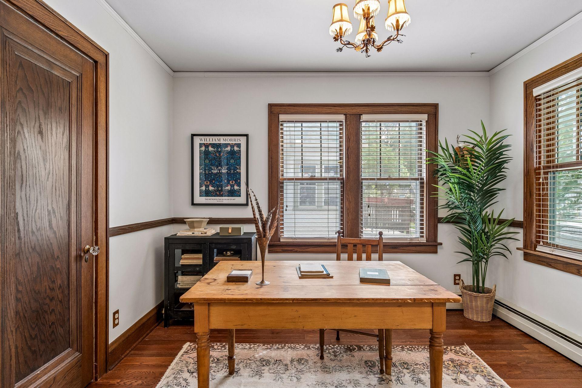 Third bedroom is situated at front of home off of foyer, currently staged as a home office.