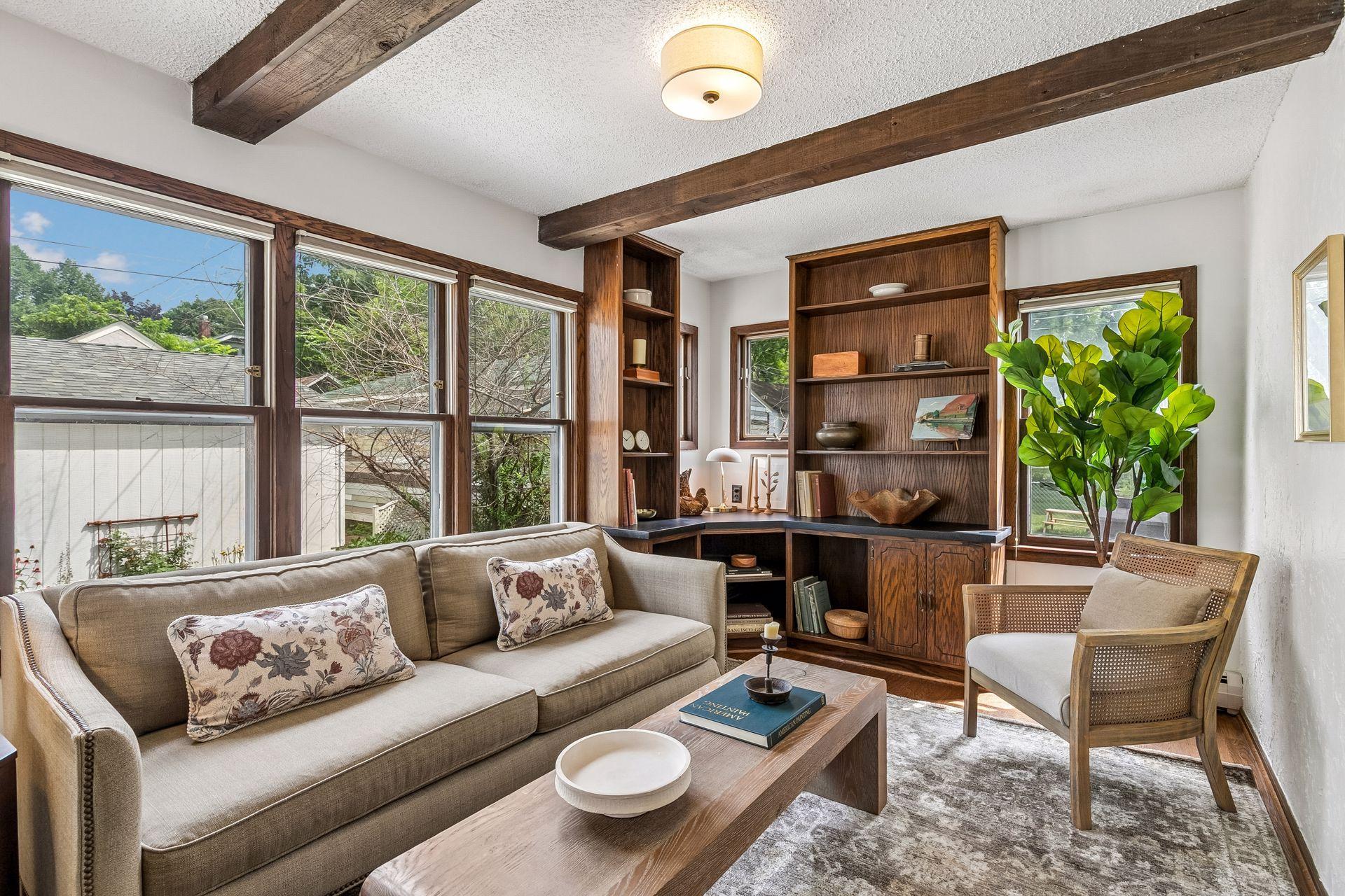 Great den with beamed ceilings on east side of house for morning light-great den or office~