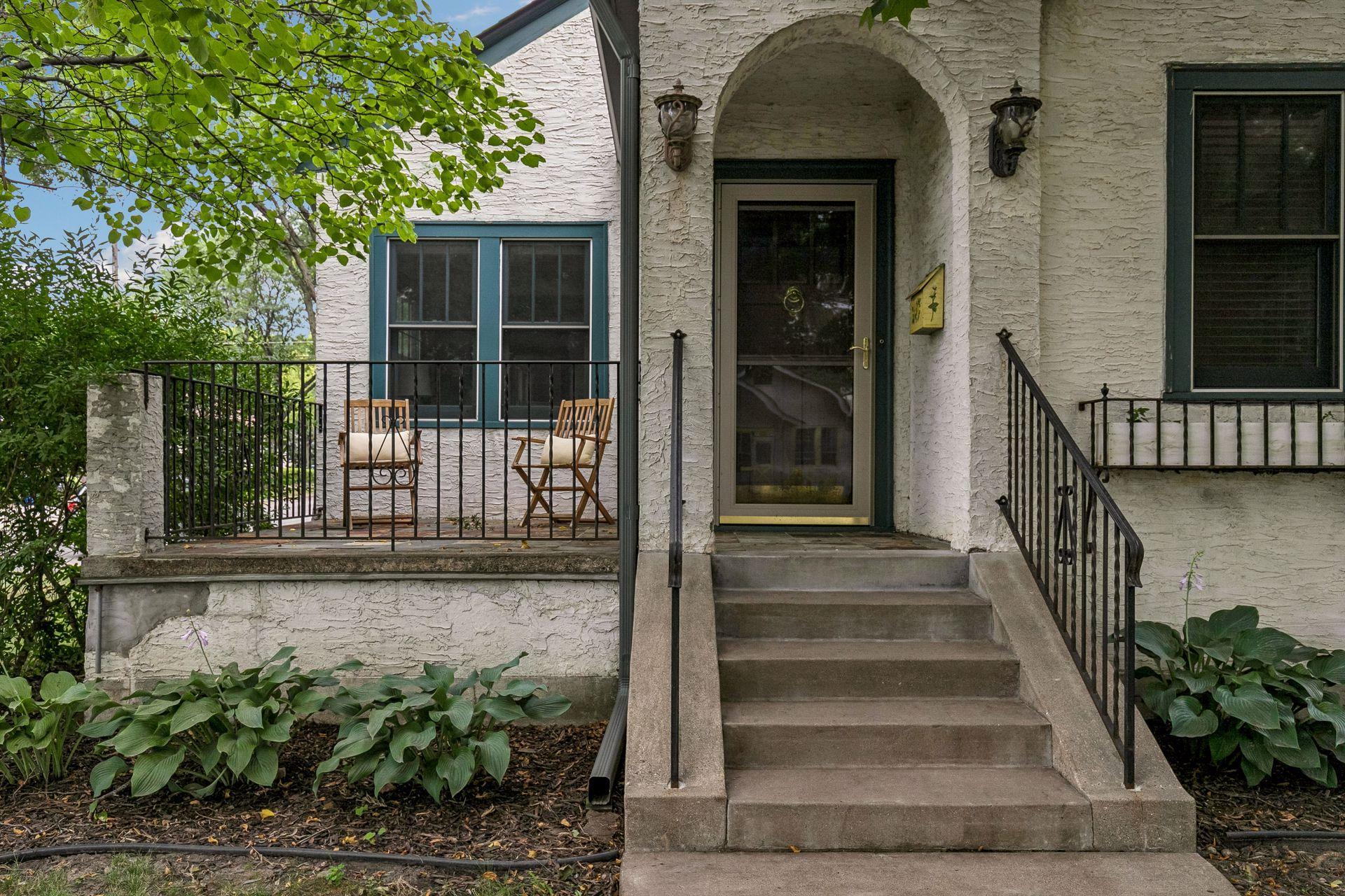 Flagstone front patio and arched entrance