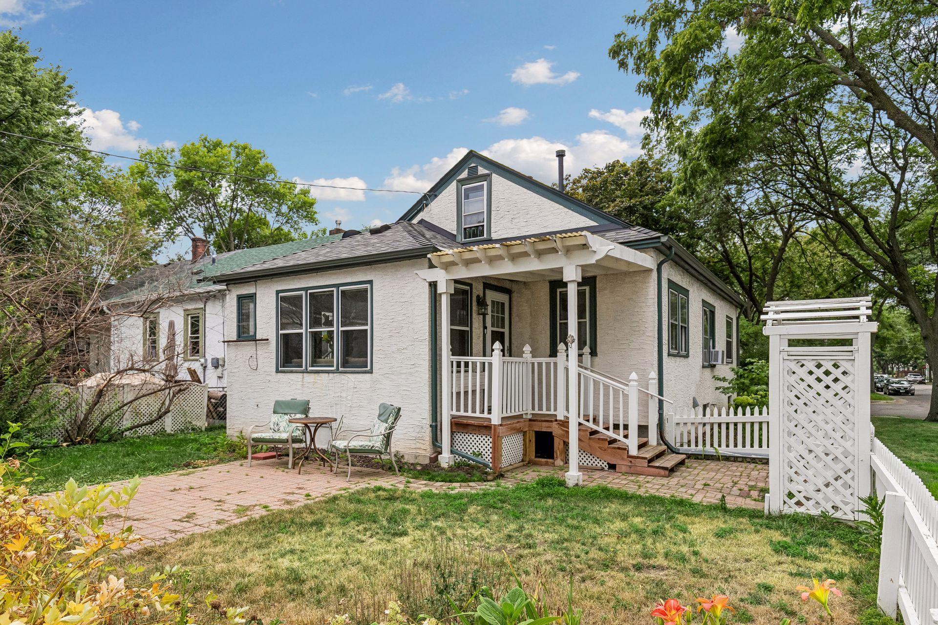 White picket fence and arbor