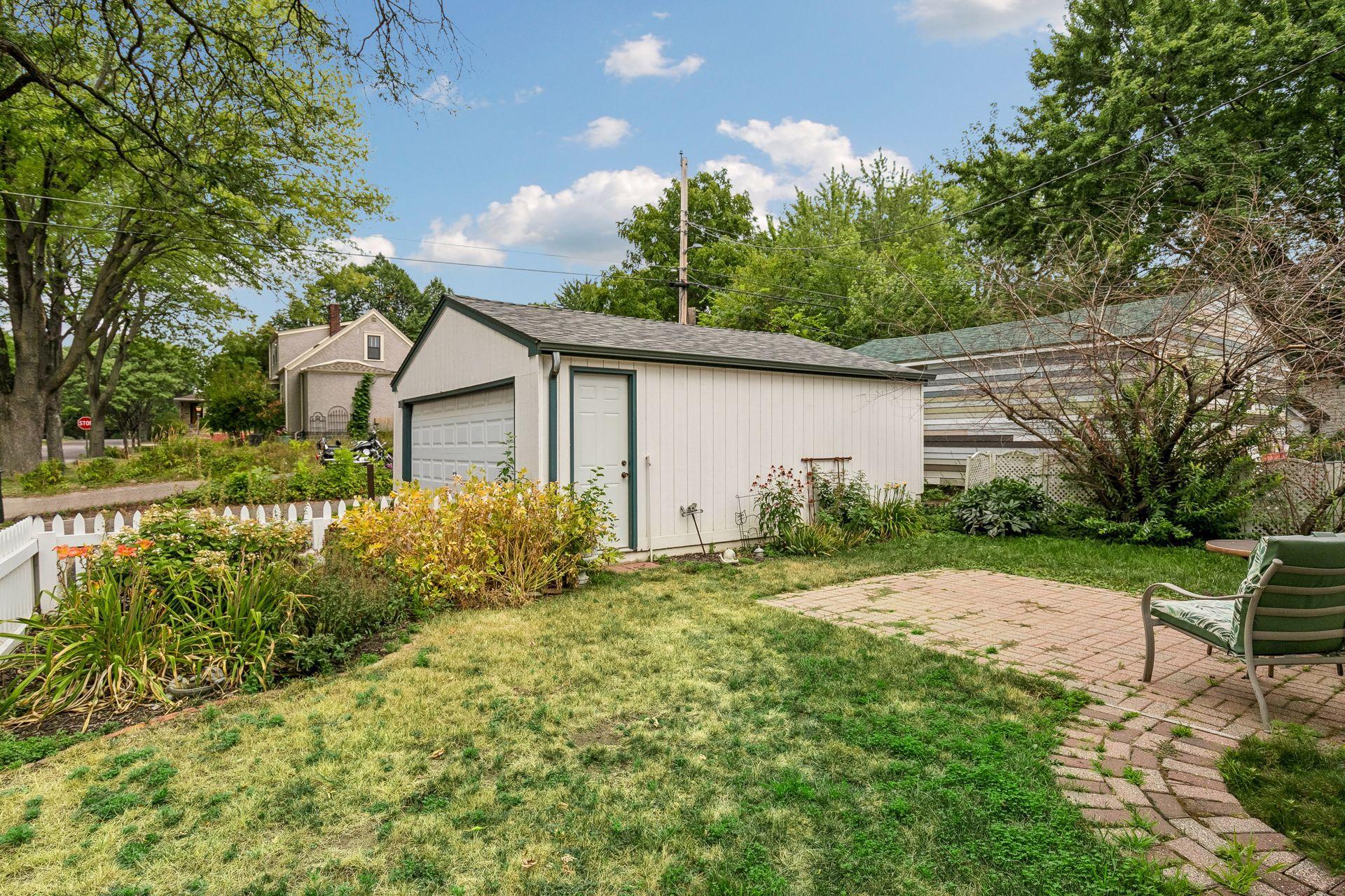 View across backyard towards 2 car garage