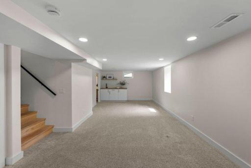 Updated lower-level living area featuring contemporary finishes, comfortable proportions, and a versatile layout.