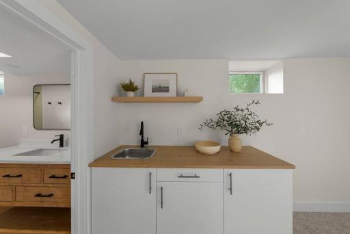 Convenient wet bar adds functionality and style to the finished lower level, making entertaining easy.